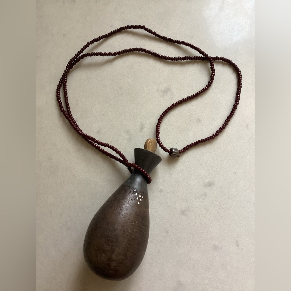 African Bottle on Garnet Bead Necklace